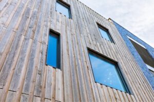 Low-maintenance and durable wood exterior wall cladding